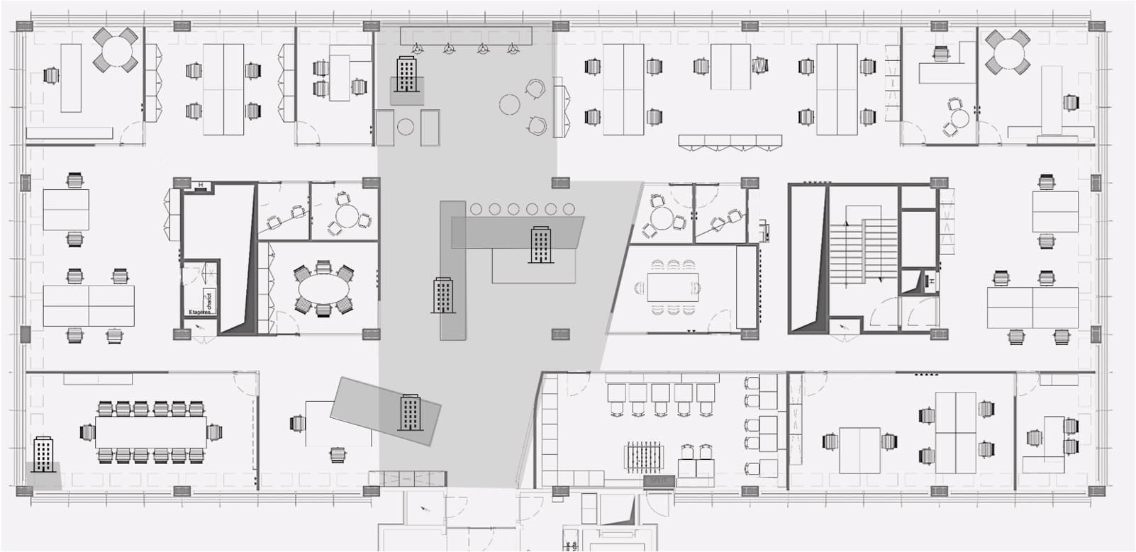 Architectural floor plan of a modern office layout showing workstations, meeting rooms, lounges, collaborative zones, and circulation areas in a clearly organized arrangement.