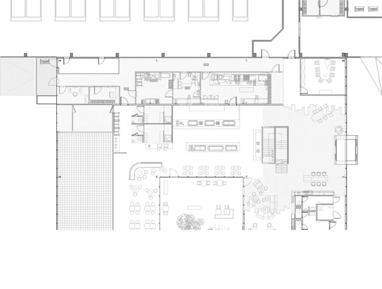 Architectural floor plan of a kitchen and dining area layout, including service zones, seating arrangements, and outdoor patio access.