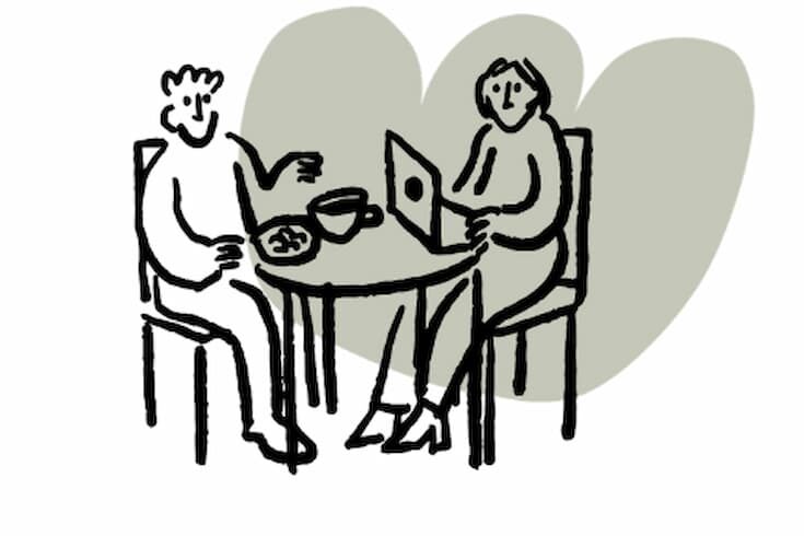 Hand-drawn illustration of two people sitting at a round table, one working on a laptop and the other eating, with a light green organic shape in the background.